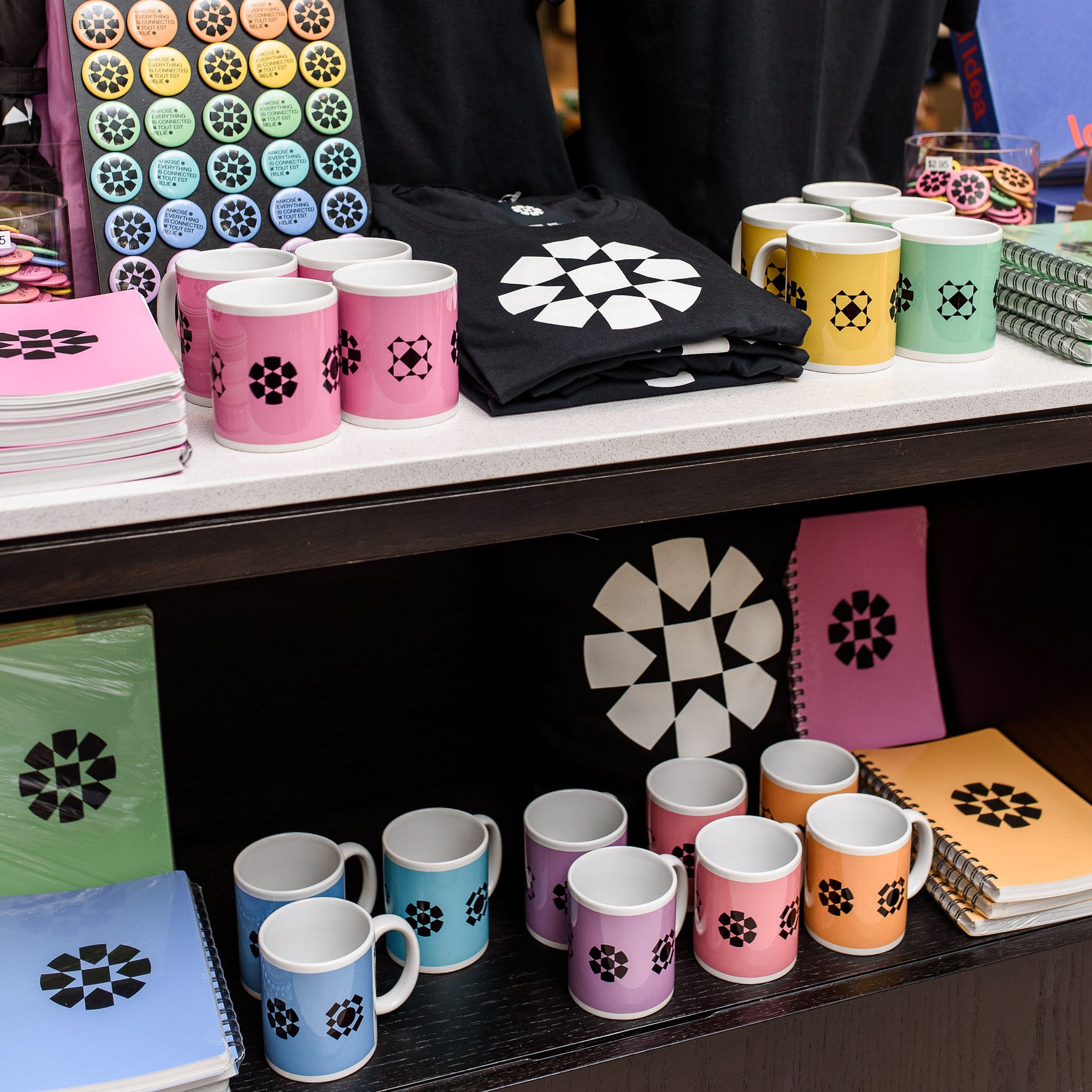 NGC logo mugs, t-shirts, piins and notebooks on display in the Boutique.